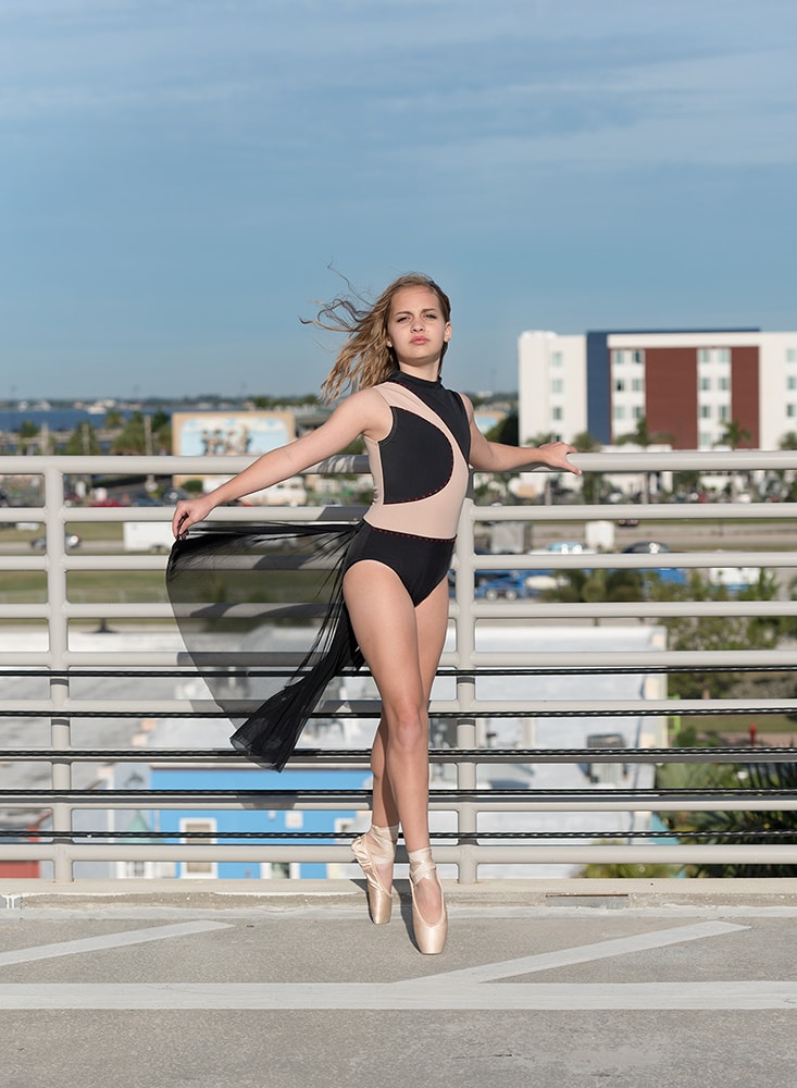 Tween ballerina on a roof top parking garage