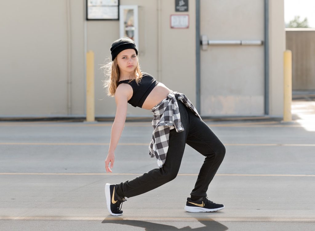 Hip hop dancer posing in a parking garage