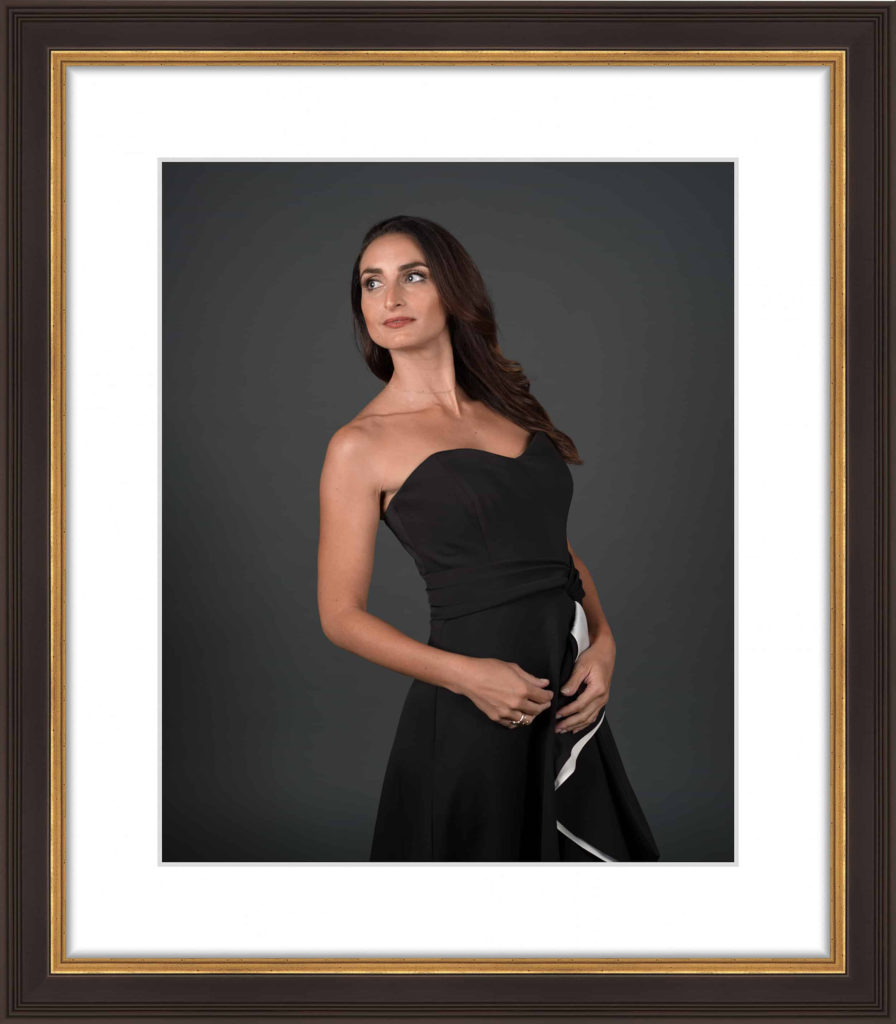 Beauty portrait in a black and gold frame with white matt