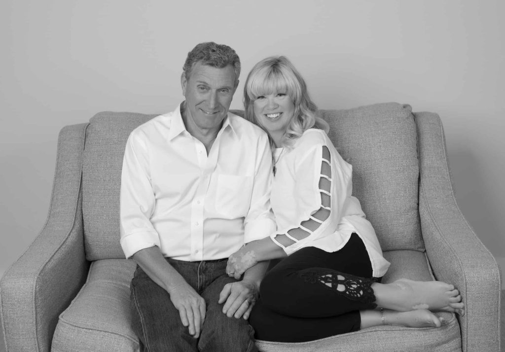 Black and white photo of a couple sitting on a sofa